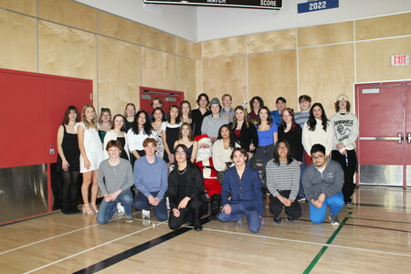 Grade 12 class with santa in front of the christmas tree